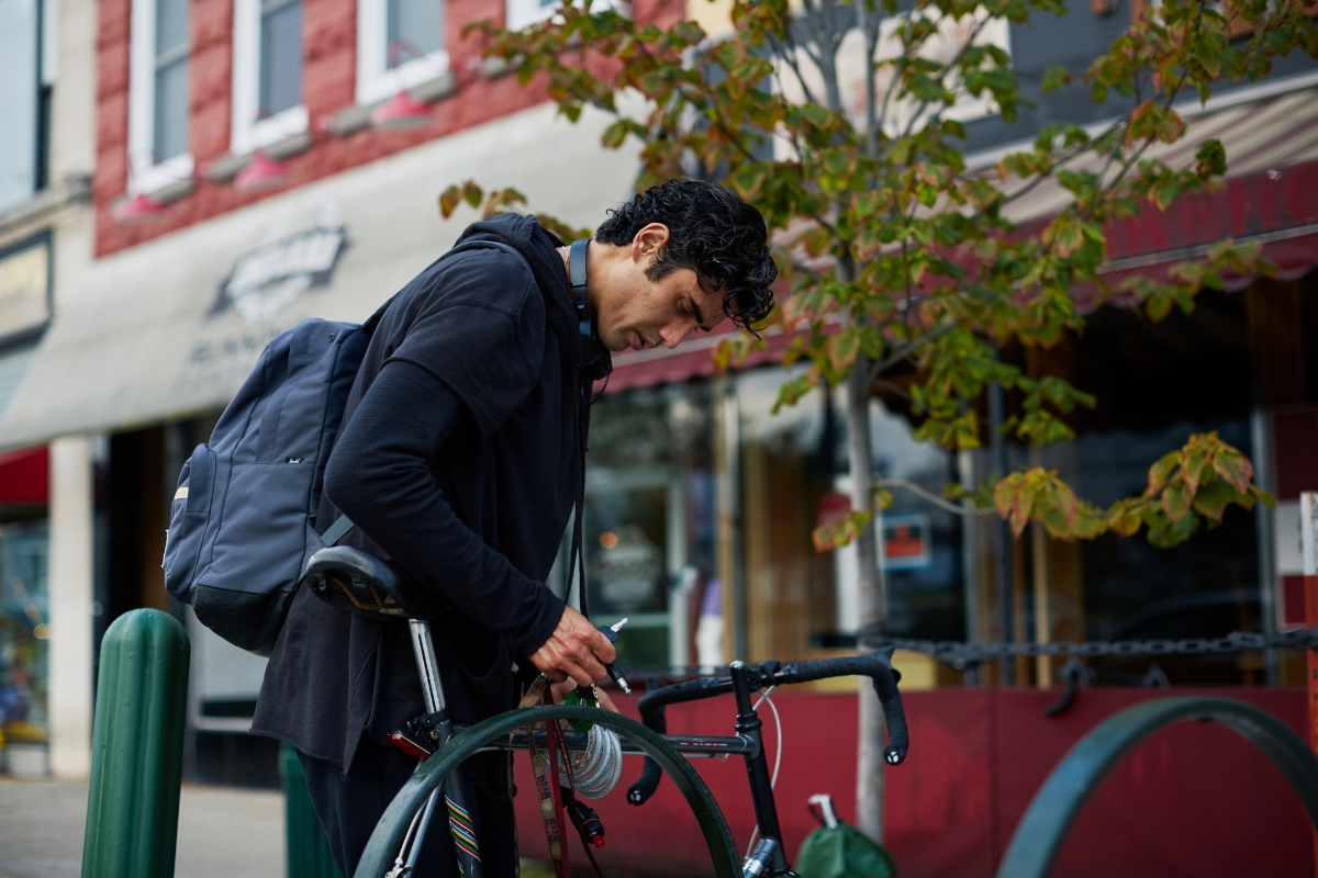 photo of a bike being locked on a bike rack