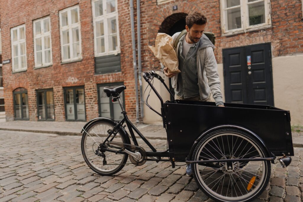 Man unpacking cargo bike