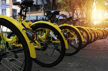 Photo of yellow public bike rental station.